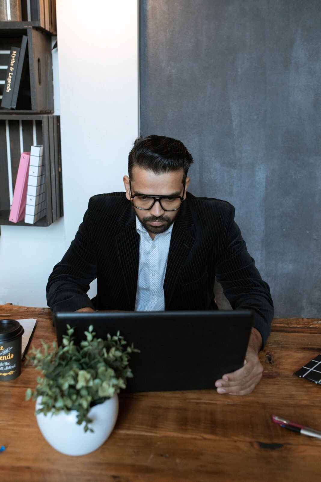 7 Skills Every Nigerian Entrepreneur Needs to Win A business owner standing with arms folded, ready to build a company