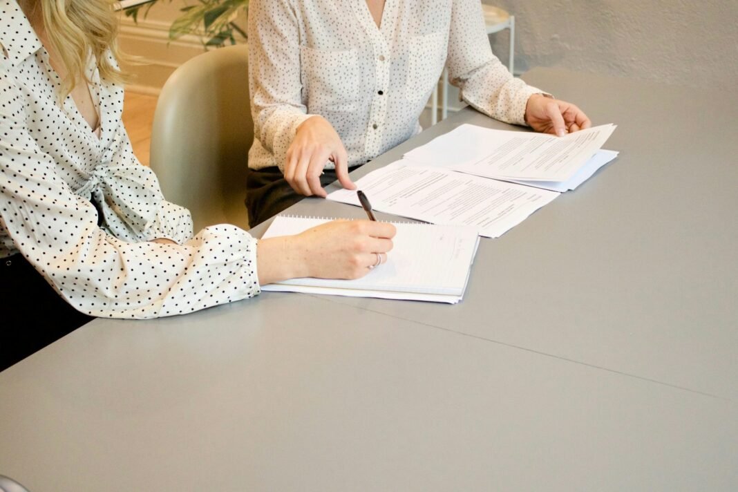 How to Register a Business in Nigeria With the CAC: A Beginner’s Guide Entrepreneur signing business registration documents