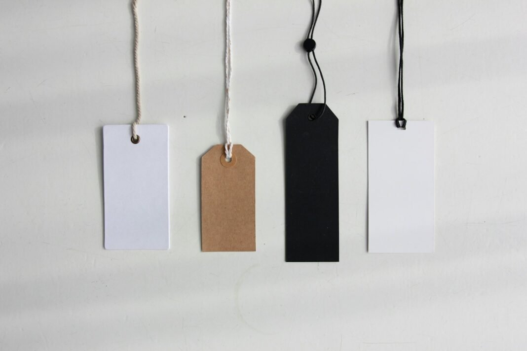 How to Price Your Products and Services Profitably Blank paper price tags hanging on strings