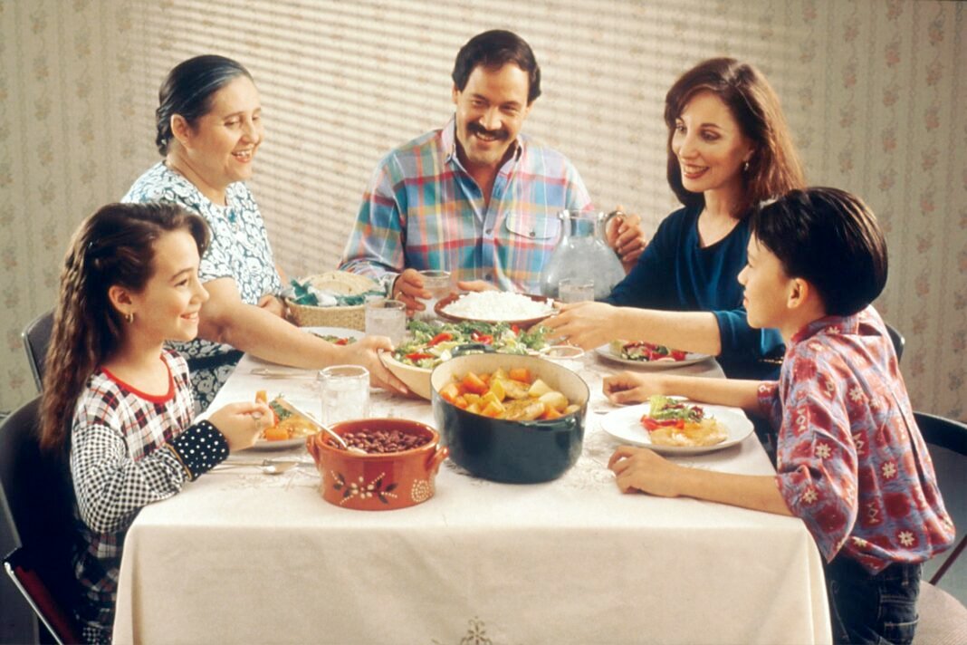 Family sharing a meal together around a dining table