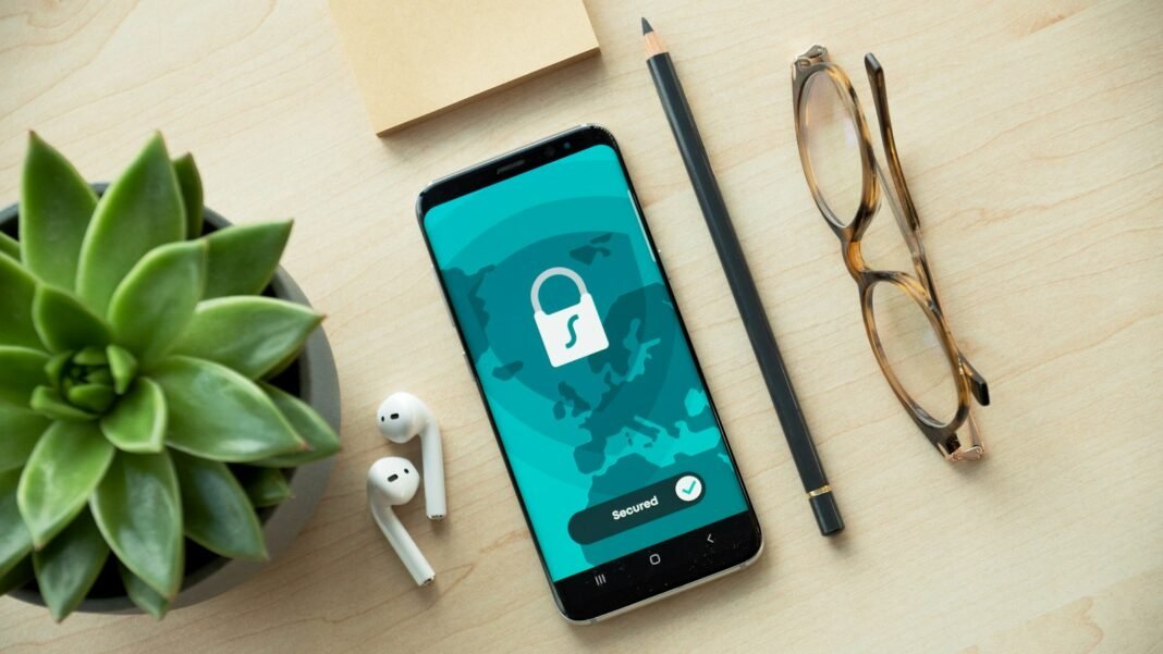 Online Privacy in Nigeria: Your Rights Under the Data Protection Act 2023 Smartphone displaying a padlock icon on a desk, representing data privacy