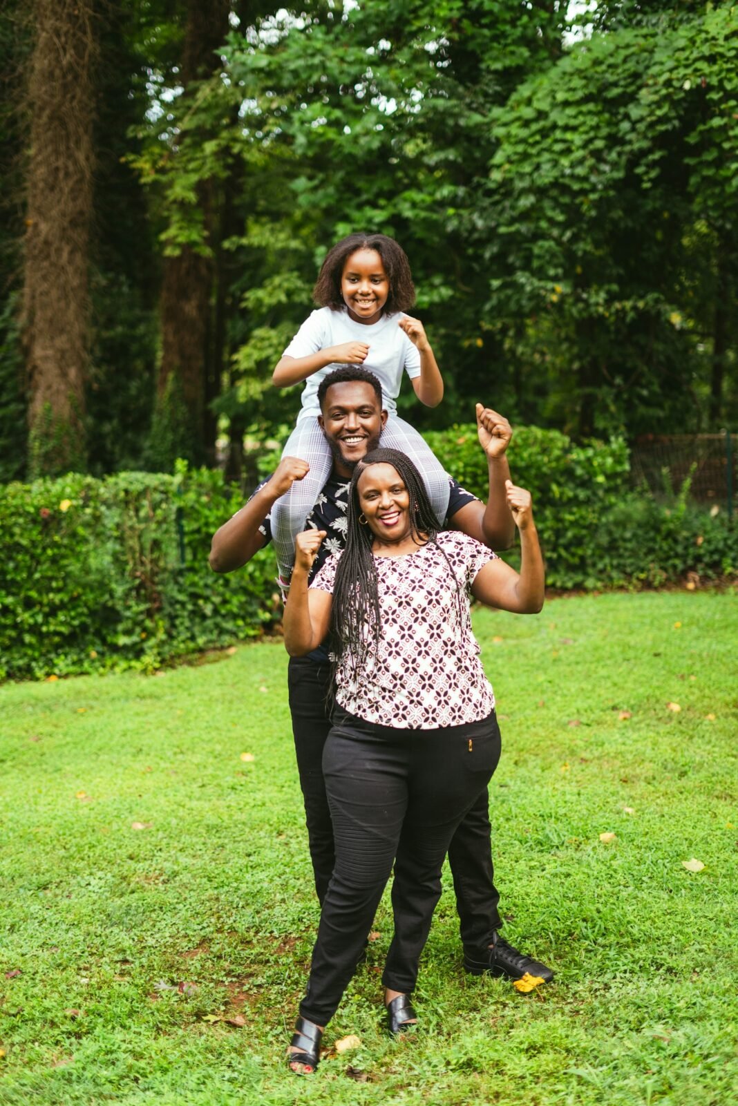 Black Tax: How to Support Family Without Sabotaging Your Future Nigerian family smiling together outdoors