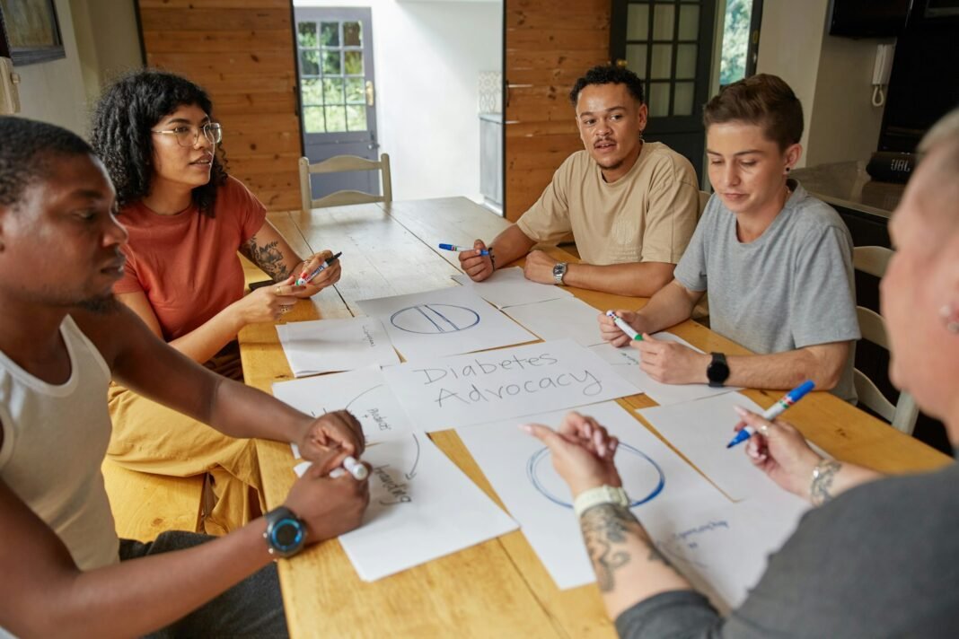 Delegation: How to Let Go Without Losing Control Team collaborating around a wooden table with documents