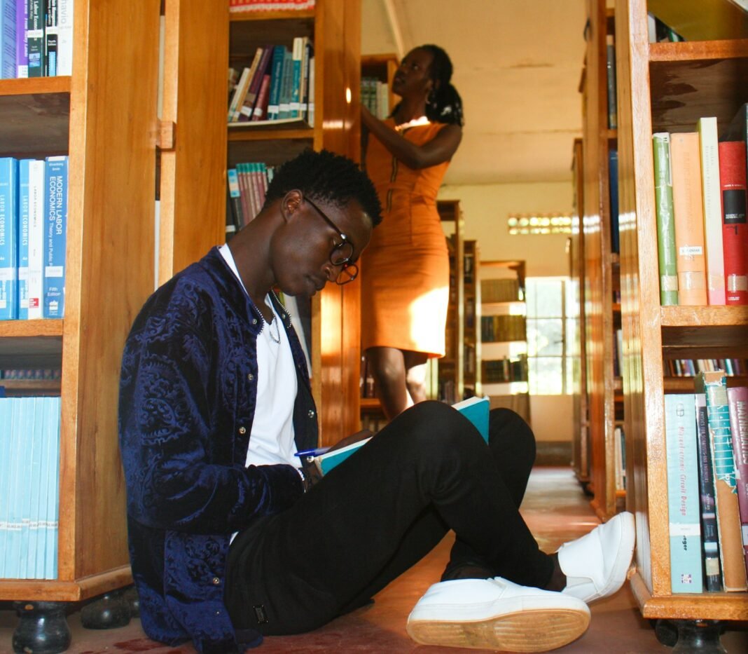 Mind Goes Blank in the Exam Hall? Here’s How to Calm Exam Anxiety Young African man sitting and reading a book, preparing calmly for an exam