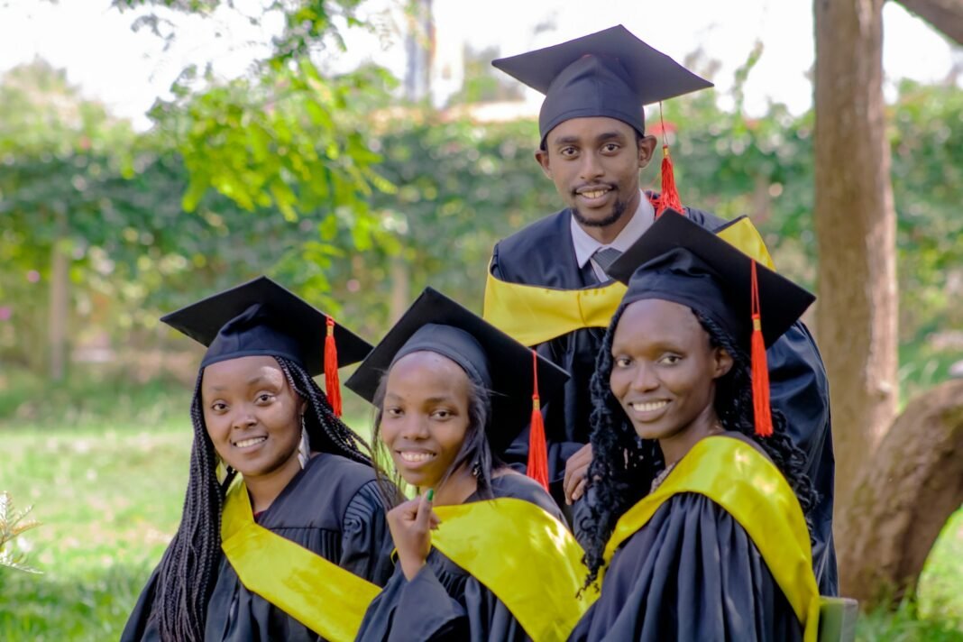 NELFUND Student Loan Explained: How to Apply, What It Covers and How You Repay Group of smiling African graduates in academic gowns and caps posing outdoors